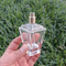 Bouteille de fantaisie de luxe 55ml en verre de parfum de conception de douane avec le pulvérisateur de chapeau de pompe