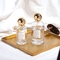 Bouteille de parfum de luxe en verre d'OEM d'or rond vide de Zamac 50ML 100ML